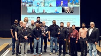 The 6G-ROCKET project team at its kick-off meeting at the University of Oulu, with remote partners joining on the screen behind them.